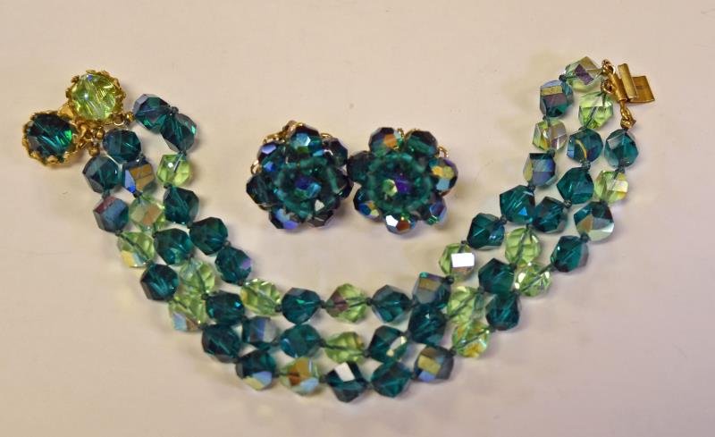 Alice Caviness Earrings: Together with a green ab glass three strand bracelet. The bracelet is unmarked measuring 7" long and 1" wide.