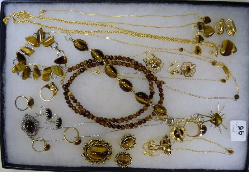 A Group of Goldtone & Tiger Eye Jewelry: Consisting of bead necklace, heart necklace and earrings, rings, bracelets and pendants.