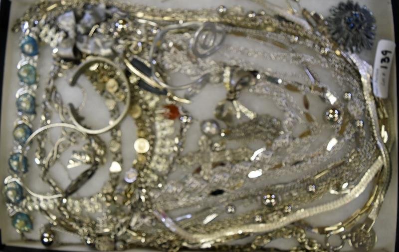 Group of Silvertone Jewelry: Consisting of mid-century link bracelet, Lizner earrings,bracelets, Tortolani pin, along with other bracelets and chains