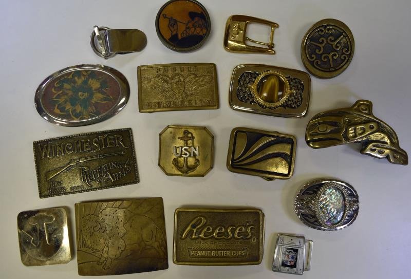 Large Group of Men's Belt Buckles: Consisting of Winchester, Purdue University, Buffalo buckle, Reese's Peanut Butter Buckle, Nickel Silver Inlaid Eagle marked LL, Sitting Bull, USN Buckle, Tigers Eye Buckle and more