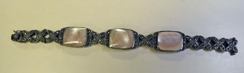 Sterling Silver Marcasite Bracelet: Bracelet is inlaid with three mother of pearl stones