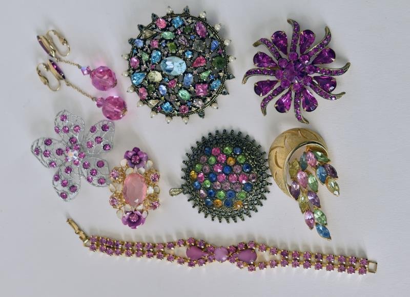 Group of Pink & Multi-Colored Pins Including a: Including a Holycraft round pin, a pink bracelet, earrings and other pins.