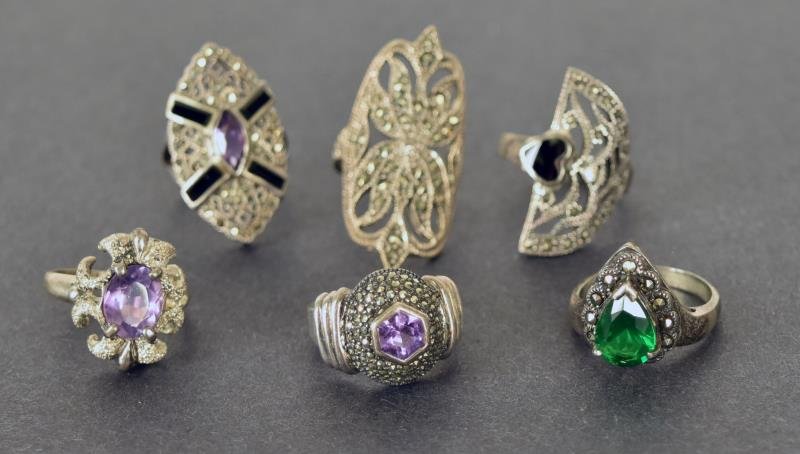 Group of Sterling & Marcasite Rings Consisting of six: Consisting of six rings, all marked sterling with marcasite, with amethyst, onyx and other stones or glass.