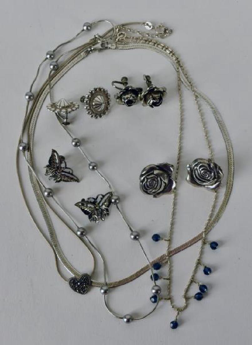 Collection Of Sterling Earrings And Necklaces: Consists Of Two Pair Of Rose Earrings, One Pair Of Butterfly Earrings, One Pair Of Umbrella Earrings And Four Necklaces, One Has Marcasite Heart, One Has Silver Balls And One Has Blue Stones