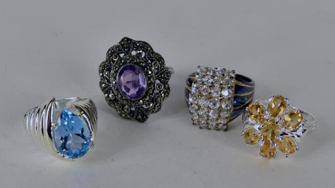Collection Of Four Sterling Silver Rings: Includes Blue Topaz, Citrine,rhinestone And Marcasite With Amethyst.