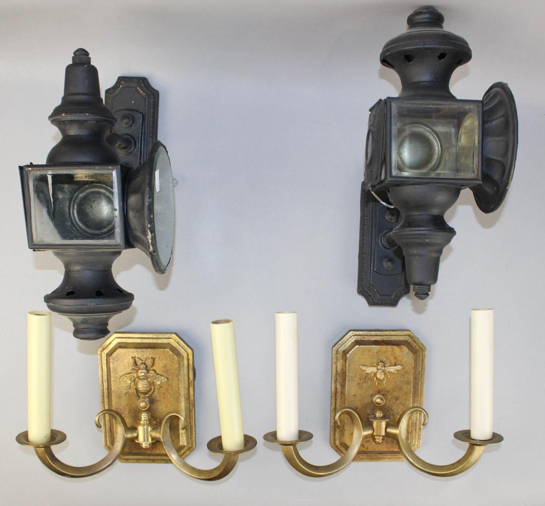 TWO SIMILAR GILT METAL 'BEE' WALL SCONCES AND A PAIR OF: TWO SIMILAR GILT METAL 'BEE' WALL SCONCES AND A PAIR OF BLACK PAINTED METAL CAR LIGHTS the first with canted corner rectangular backplates with applied bees issuing two scrolling candle arms, h: 7 x w