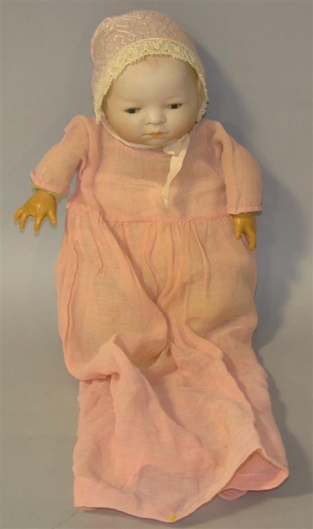 GERMAN BYE-LO GRACE PUTNAM BABY DOLL: Having a bisque head, cloth body,elluloid hands and sleeping eyes h: 9.50 in.