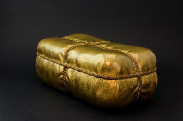 TIFFANY & COMPANY BRONZE HINGED GIFT BOX: Box is rectangular and made to look like a gift with rope wrapped around it. Inscribed with the makers mark on back. Saying "Tiffany & Co. Union Square". Measures 3 3/8" height x 8 1/2" length x 4 1/4