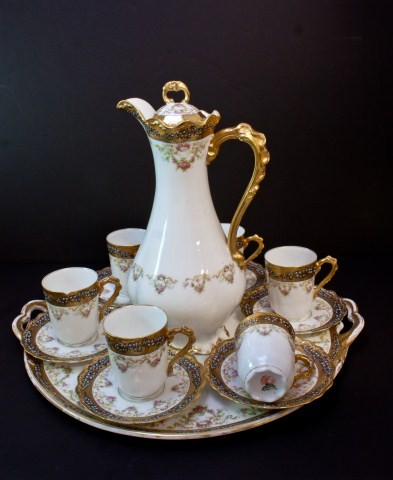 ANTIQUE LIMOGES FRANCE 14pc CHOCOLATE SET: Has a beautiful floral, hand painted design with gold gilting and enamel beading. Set includes 6 cups, 6 saucers, 1 chocolate pitcher with lid and two handled serving tray. All pieces have the red L S