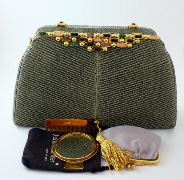JUDITH LEIBER GRAY LIZARD LEATHER PURSE: Fabulous Judith Leiber gray lizard leather purse. Has gold hardware. gray silk interior. Has hide away strap. Multicolor stone design clasp. In cludes Judith Leiber coin purse, mirror and comb. Measur