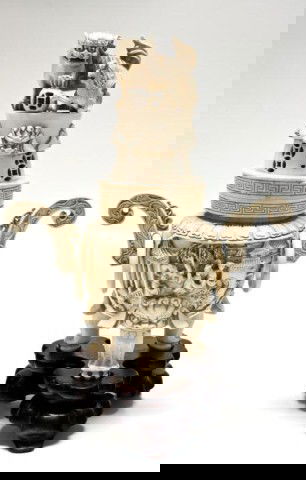 CHINESE IVORY HAND CARVED FIGURAL INCENSE BURNER: Has a fabulous 3-D palace scene design to front and back of censor with etruscan bordering. Has 3 figural foo dog feet. Two handles have a scroll design with rings. Cover depicts a foo dog and young p