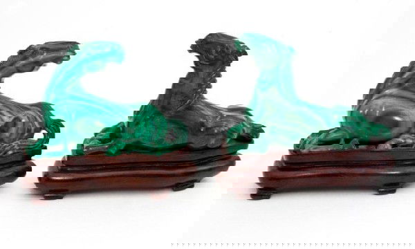 PAIR OF CHINESE MALACHITE SITTING HORSE FIGURES: Beautiful pair of hand carved malachite horse figures. Both horses are sitting. One is looking forward, the other is looking behind. Wonderful detail throughout. Includes fitted wooden stand for both.