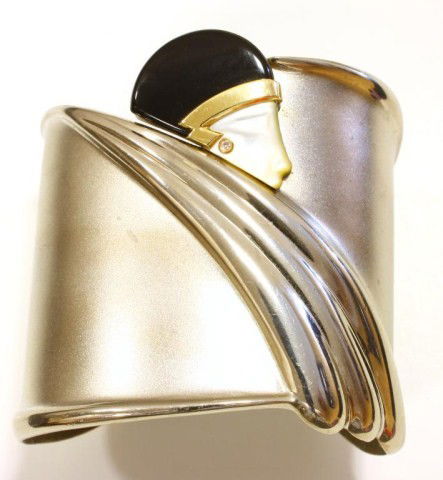 ERTE ART DECO SILVER w ONYX DIAMOND CUFF: Great art deco silver cuff with onyx hat on lady. 14k yellow gold trim and small diamond earring. Measures 2 1/4" W (5.7cm)