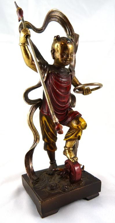 CHINESE COLD PAINTED BRONZE FIGURE OF CHILD: Fabulous Chinese cold painted bronze depicting a young girl in ceremonial garb with spear and ring. Under her left foot is a tambourine. 19th century. No apparent signature. Measures 8" height (20.2cm