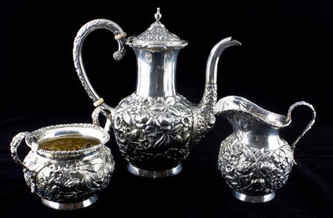 3 PIECE REPOUSSE STERLING SILVER TEA SET: Amazing detail and quality. Fabulous floral repousse design throughout each piece. No monograms or removals. The set includes the following pieces and measurements: Teapot: 7" (17.5cm) Creamer: 3 3/4"