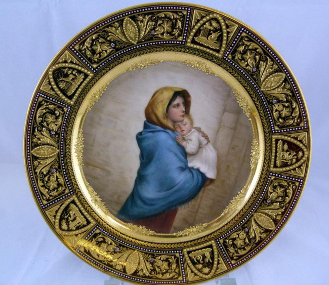 ROYAL VIENNA PORCELAIN PLATE WAGNER MOTHER/CHILD: Wonderful genuine Vienna porcelain plate depicting a mother and child. Bordering the picture is a raised floral gilted design. Outer rim has an intricate raised scrolled gilt and animal design. Also h