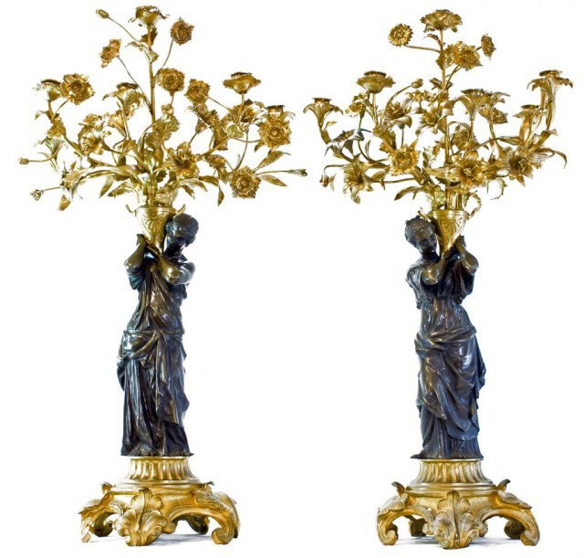 PAIR OF 19th CENTURY 6 ARM CANDELABRAS: Magnificent pair of French 19th Century 6 arm candelabras. Having Exquisite Dore bronze floral pattern leading to the 6 candle bases. Adorned by a pair of dark bronze patina robed women (left and righ