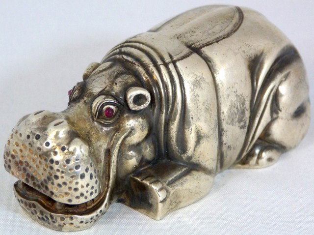 JULIUS RAPPOPORT RUSSIAN SILVER HIPPOPOTAMUS FIGURE: RAPPOPORT, Julius A. (1864-1916) Fabergé’s most important supplier of silver objects in St. Petersburg. Depicts a hippopotamus laying down. He has red jeweled eyes. Has the St. Petersburg Kokoshnik