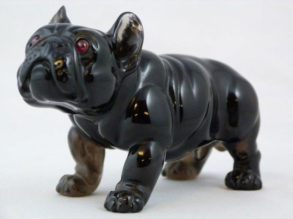 FABERGE OBSIDIAN HAND CARVED BULLDOG FIGURE: Magnificent Russian hand carved bulldog figure by Faberge. Dog has cabochon rubies set gold mounted in the eyes. Early 20th century. Includes fitted box. Figure measures 2 1/4'' (5.8cm) height x 3 1/2
