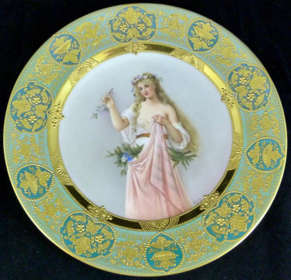 ROYAL VIENNA PORTRAIT PLATE OF WOMAN WAGNER: Fabulous hand painted Royal Vienna porcelain plate of partially nude woman with flowers. Intricate gilded border with green background. Signed lower right by Wagner. Blue Bee-hive mark to back. Impres