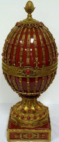 PALATIAL PORCELAIN AND BRONZE EGG: Amazing large porcelain egg with bronze foot and cladding. Has oval and round porcelain beading throughout. Egg is hinged and reveals a white interior. No apparent signature. 20th century. Measures 24