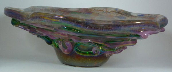 MURANO ART GLASS LARGE CENTERPIECE BOWL: Has a beautiful multicolor speckle design with shapes in glass. Green and pink overlay design to exterior. No apparent signature or marks. 20th century. Measures 6" height x 19 1/4" width x 14 1/2" (1