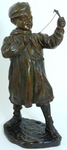 JOSEP CARDONA BRONZE FIGURE OF BOY WITH SLINGSHOT: Josep Cardona (SPANISH, 1878-1923). Bronze figure depicting a young schoolboy shooting a slingshot. Nice brown patina. Signed to base. Measures 12 1/2" height (31.7cm).