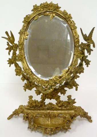 ANTIQUE FRENCH BRONZE FLORAL TABLE MIRROR: Has figural floral design throughout with birds and butterflies. Beveled glass mirror. 19th century. Measures 14" height (35.5cm).