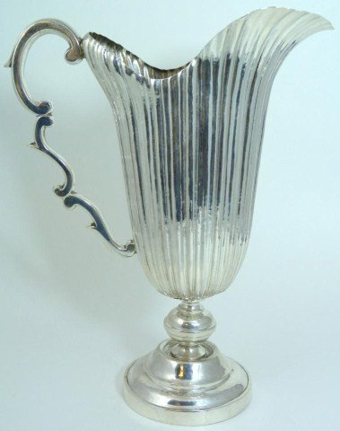 BUCCELLATI GIANMARIA STERLING SILVER PITCHER: Finely crafted, hand hammered sterling silver pitcher by the Italian maker Buccellati. Weight 25.510ozt (793.4g). Measures 10 1/4" height.