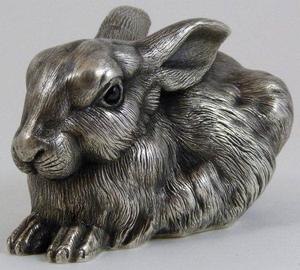 RUSSIAN SILVER SEATED RABBIT FIGURE: Russian silver rabbit figure. Has town marks and 84 silver purity marks to bottom. Also hold workmaster marks to bottom. Measures 2 1/2" height x 4" length x 2 1/2" width (6.3cm x 10.1cm x 6.3cm). Wei