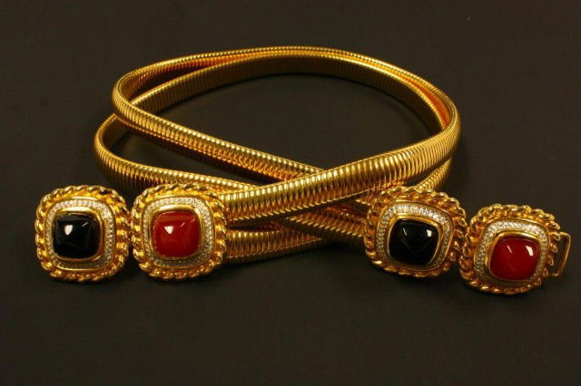 JUDITH LEIBER GOLD BELT w RED & BLACK STONES: Wonderful Judith Leiber belt with black and red stone design. Has crystals around the stones. 2 band stretchable design. 27 3/4" length (70.5cm)