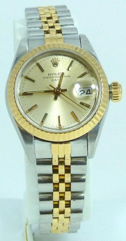 ROLEX 18k YG OYSTER PERPETUAL DATE WATCH: Ladies Rolex Oyster Perpetual Date 2-tone stainless & 18kt yellow gold. Fluted yellow gold bezel, champagne dial with bar markers & calendar. Jubilee bracelet measures 8" (20cm). Band condition 65%. S