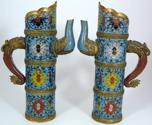 18th C ANTIQUE CHINESE CLOISONNE CHAMPLEVE TEAPOTS: Pair of exquisite Chinese gilt-bronze, cloisonne and champleve enamel dragon teapots. Each is cylindrical in form and has figural dragon handle and spout. Vivid multicolor enamel design depicts flower