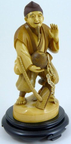 CHINESE IVORY CARVING OF FARMER WITH POT OF GOLD: Depicts a farmer with rake and pot of money which is spilling onto the floor. His face shows extreme happiness and contentment from a good harvest. Signed to bottom. Measures 7" H + 1" base (17.5cm + 