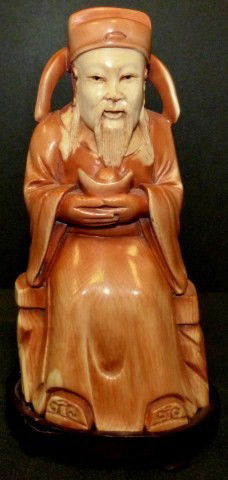 CHINESE IVORY HAND CARVED WISE MAN FIGURE: Chinese carved wise man figure sitting down holding a gourd. 19th/20th century. Signed to bottom. Measures 5 3/4" height (14.6cm).