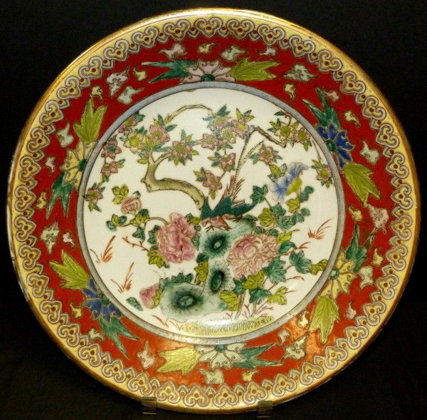 T'UNG CHIH CHINESE PORCELAIN ENAMELED CHARGER: Antique Chinese porcelain enameled charger depicting trees, birds and flowers. T'ung Chih Reign marks to bottom (1862-1873). Measures 14 1/4" diameter (36.1cm).