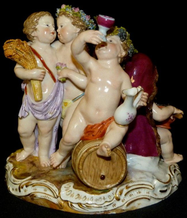MEISSEN GERMAN PORCELAIN CHERUB GROUP FIGURE: Meissen German porcelain cherub figure depicting cherubs cooking, drinking and celebrating. Blue cross swords mark to bottom. Etched 1068 and impressed 144 to bottom. 19th/20th century. Measures 5 7/8