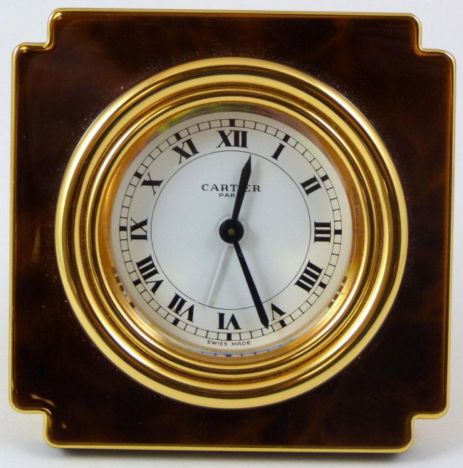 LES MUST DE CARTIER PARIS TORTOISE DESK CLOCK: Fabulous clock by Cartier. Has tortoise outline to face and sides of clock. White enamel clock face with black Roman numerals. Black hour and minute hands with silver seconds hand. Includes original f