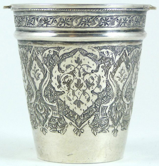 ANTIQUE SLAVIK SILVER CHASED FLORAL CUP: Antique cup with hand chased floral design throughout and bordering. Marked 84 with work master marks to bottom. Late 19th or early 20th century. Measures 2 1/2" height (6.3cm). Weighs 72 grams/2.315 