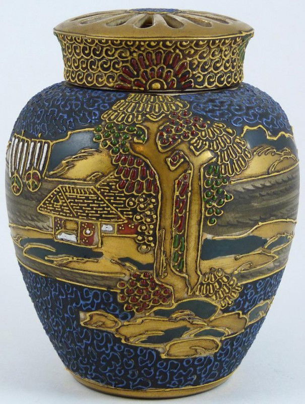 ANTIQUE SATSUMA MORIAGE PORCELAIN GINGER JAR: Antique Satsuma Moriage covered ginger jar with enameled coastal scene with boats. Has reticulated screen design to cover. Signed to bottom. 19th century. Measure 5" height (12.7cm).