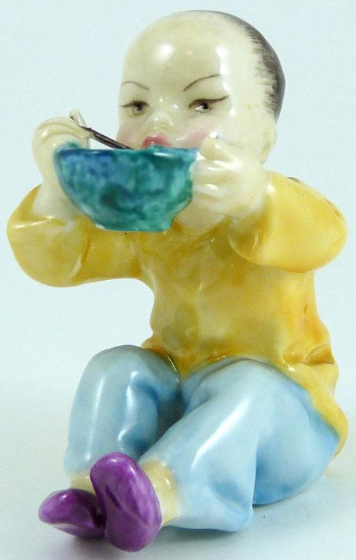 ROYAL WORCESTER FG DOUGHTY FIGURE CHINA: Royal Worcester World figure depicting boy eating rice. Represents the country of China. #3073. Measures 3 3/8" height (8.5cm). Guaranteed original.