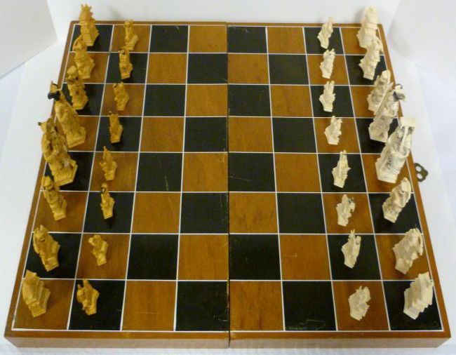 CHINESE IVORY HAND CARVED CHESS SET w BOARD: Set includes white and tea stained figures. No apparent signature. Mid to early 20th century. King measures 5" height (12.7cm). Pawn measures 2" height (7.6cm).