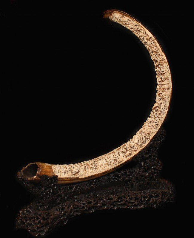 MONUMENTAL CHINESE CARVED IVORY MAMMOTH TUSK: Breath taking hand carved mammoth tusk. Has incredibly intricate polychromed scene depicting people paying homage and presenting gifts to the Immortals. There are 81 individually carved figures (inclu