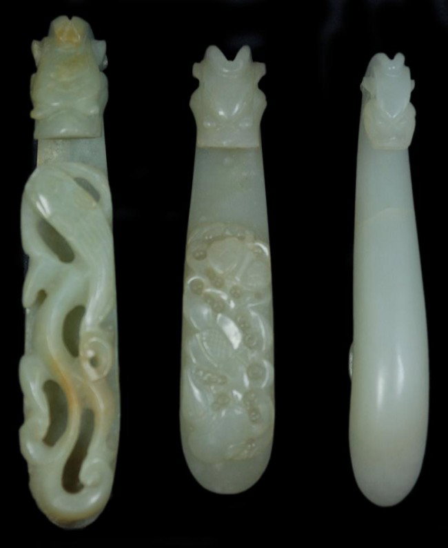 3 CARVED JADE CHIH LUNG DRAGON GARMENT HOOKS: 3 Chih Lung Dragon scepter garment hooks. Each has a hand carved dragon design. One has fully relief carved dragons to handle. The next has a relief carved flower design to handle. The last has a smoo