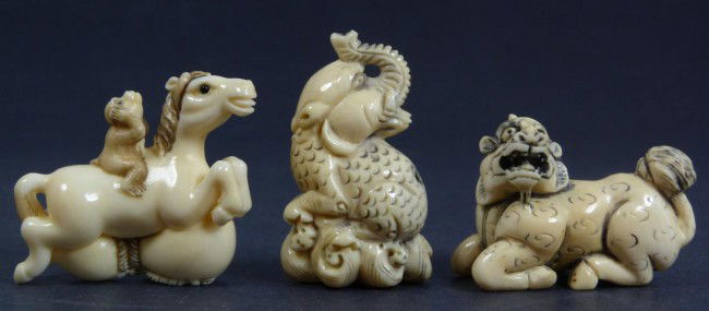 3pcs JAPANESE CARVED IVORY ANIMAL FIGURINES: 3 Japanese hand carved ivory polychromed netsuke figures. One depicts a monkey riding a horse over a double gourd. The next depicts a sitting kylin beast. The last depicts an elephant headed scaled be