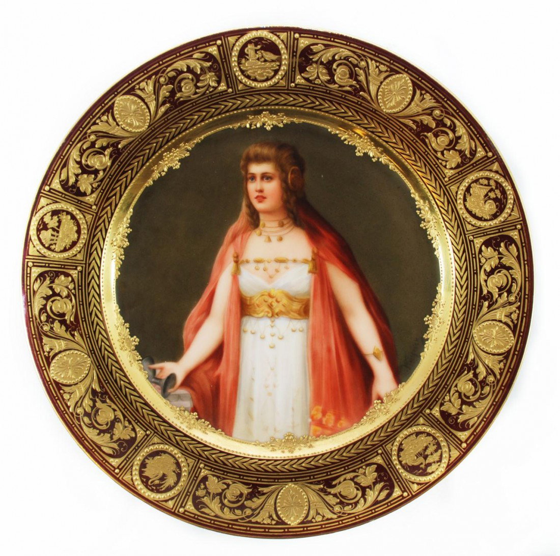 ROYAL VIENNA "MADELAINE" PORTRAIT PLATE WAGNER: Magnificent Royal Vienna hand painted porcelain portrait plate depicting Saint Mary Magdalene. Titled "Madelaine". This plate is intricately bordered with gilded laurel wreath, scenes with animals and