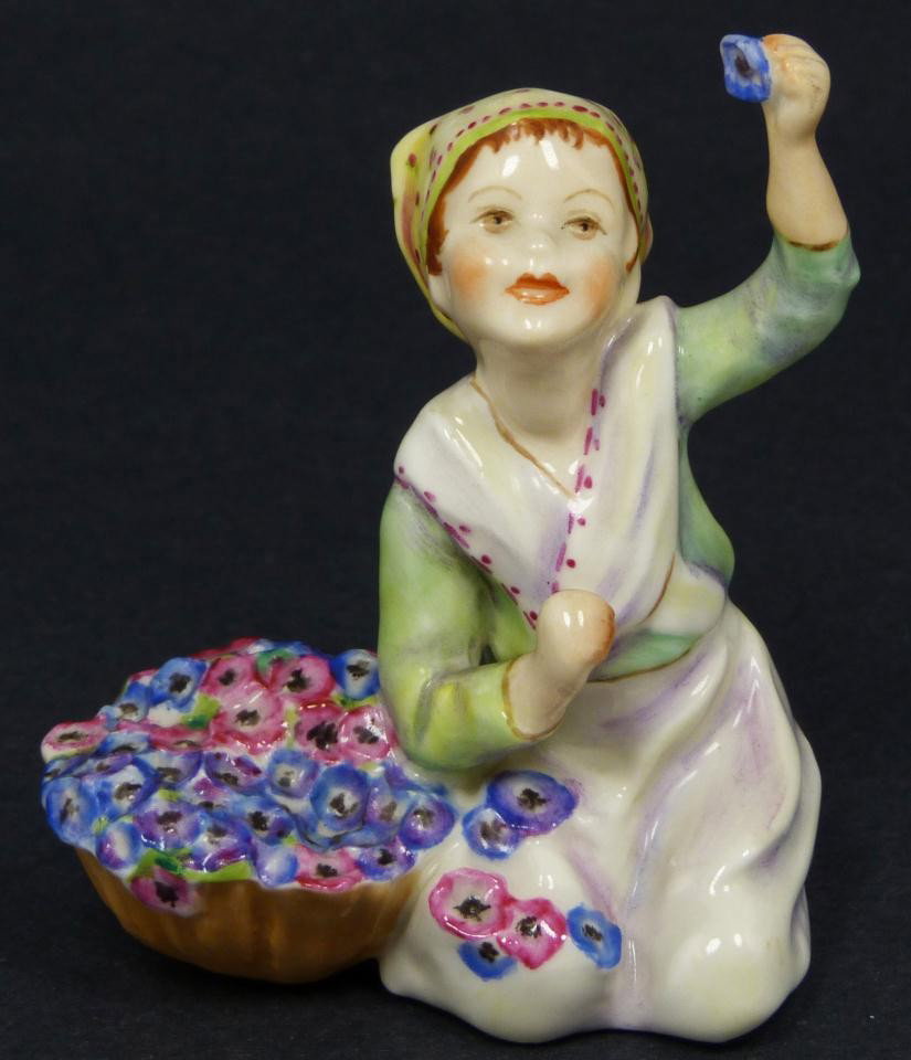 ROYAL WORCESTER FG DOUGHTY FIGURE ITALY: Royal Worcester World figure depicting girl with flowers. Represents the country of Italy. #3067. Measures 3 1/2" height (8.9cm). Guaranteed original. Very good. Extremely minor chip to bottom of bask