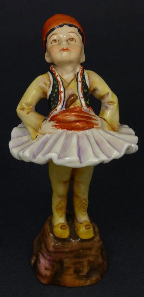 ROYAL WORCESTER FG DOUGHTY FIGURE GREECE: Royal Worcester World figure depicting boy with hands on hips. Represents the country of Greece. #3069. Measures 3 1/2" height (8.9cm). Guaranteed original. Condition: No apparent chips, cracks, crazi