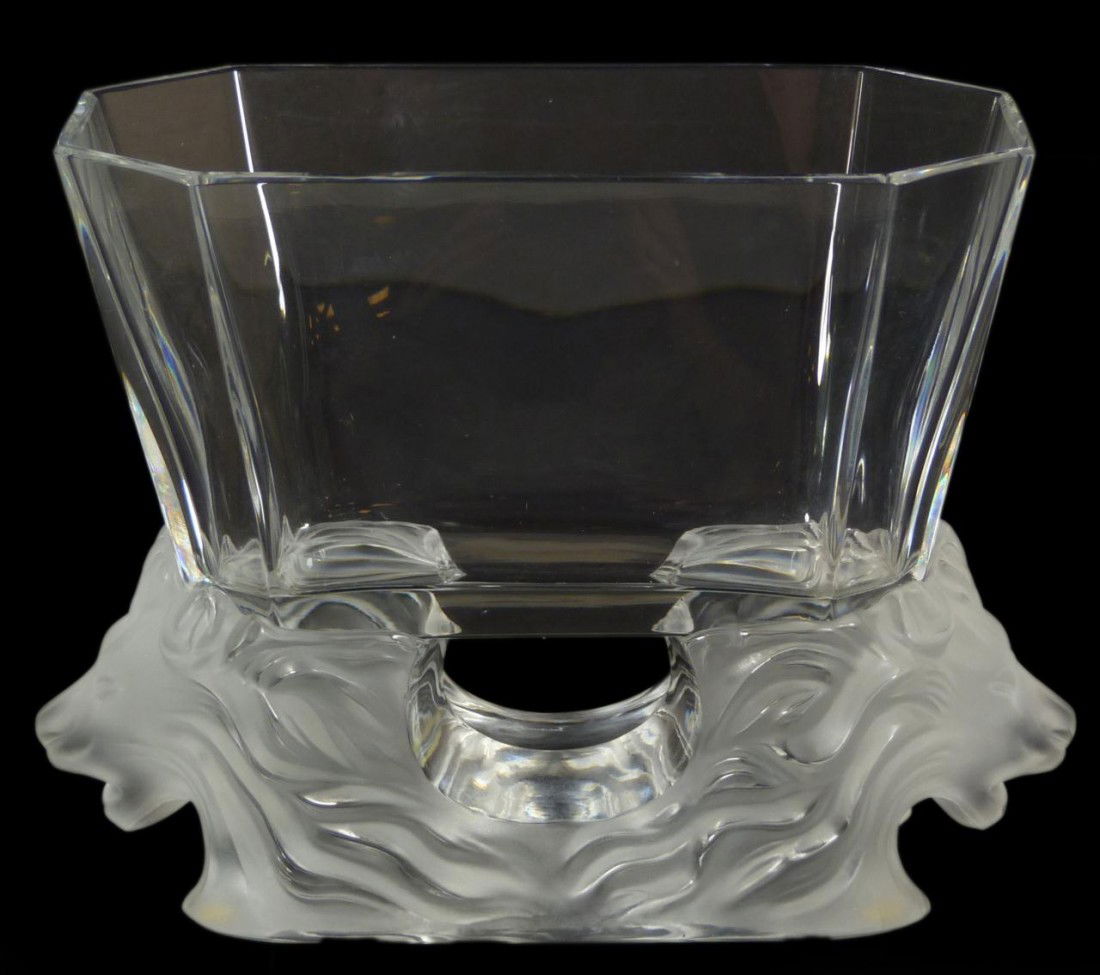 LALIQUE FRENCH CRYSTAL "VENISE" LIONS VASE: Lalique French crystal "Venise" octagonal vase. Has figural lion head design to base. Signed "Lalique France" to base. Measures 6 3/8" height x 8 3/4" length x 4 7/8" depth (16.1cm x 22.2cm x 12.3cm).