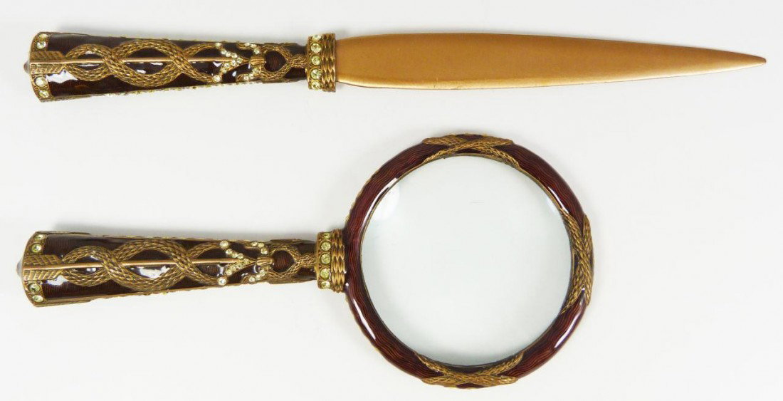 2pc DECO STYLE JEWELED & ENAMELED LETTER SET: Art deco enamel on copper magnifying glass and letter opener desk set. Has an elegant brown enamel guilloche design over copper. Has raised feathered serpentine design with arrow. Has approximately 86